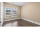 Bright bedroom with hardwood floors and windows overlooking the neighborhood at 1600 Palmetto Palm Dr., Myrtle Beach, SC 29579