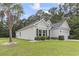 Charming home exterior with well-manicured lawn and a side-entry garage at 1600 Palmetto Palm Dr., Myrtle Beach, SC 29579