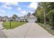 Attractive single-Gathering home with a well-maintained lawn and long driveway at 1600 Palmetto Palm Dr., Myrtle Beach, SC 29579