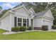 Charming home with light siding, dark shutters, and well-manicured lawn at 1600 Palmetto Palm Dr., Myrtle Beach, SC 29579