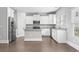 Modern kitchen featuring stainless steel appliances, granite countertops and ample white cabinetry at 1600 Palmetto Palm Dr., Myrtle Beach, SC 29579