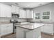 Modern kitchen with granite countertops, stainless steel appliances and white cabinetry at 1600 Palmetto Palm Dr., Myrtle Beach, SC 29579