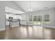 Open kitchen layout featuring stainless steel appliances, granite countertops, an island and sliding glass doors at 1600 Palmetto Palm Dr., Myrtle Beach, SC 29579