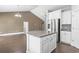 Kitchen island overlooking the open concept living space with granite countertops and stainless steel appliances at 1600 Palmetto Palm Dr., Myrtle Beach, SC 29579