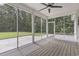 Screened-in porch with ceiling fan and wood floor at 1600 Palmetto Palm Dr., Myrtle Beach, SC 29579
