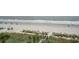 Wide view of the beach with people relaxing on the shore at 1605 S Ocean Blvd. # 204, Myrtle Beach, SC 29577