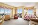 Cozy bedroom with balcony access, floral accents, sitting area and ocean views at 1605 S Ocean Blvd. # 204, Myrtle Beach, SC 29577