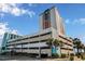 The Palace resort complex features a multi-story garage and palm trees at 1605 S Ocean Blvd. # 204, Myrtle Beach, SC 29577