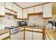 Fully equipped kitchen with stove, microwave, ample cabinetry and granite countertops at 1605 S Ocean Blvd. # 204, Myrtle Beach, SC 29577