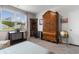 Bedroom with a window, closet, dog crate, antique armoire and other decorative items at 171 Cassina Dr., Longs, SC 29568