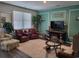 Comfortable living room with stylish decor, hardwood floors, and ample seating arrangements at 171 Cassina Dr., Longs, SC 29568