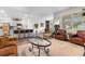 Spacious living room with hardwood floors, modern decor, and an open view to the kitchen at 171 Cassina Dr., Longs, SC 29568
