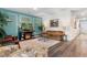 Inviting living room with hardwood floors, stylish decor, and an open view into the hallway at 171 Cassina Dr., Longs, SC 29568