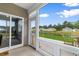 Screened in patio with sliding doors, outdoor chairs and backyard views at 171 Cassina Dr., Longs, SC 29568