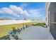 Large, fenced backyard with a patio, flowers, and well-maintained lawn at 1723 Perthshire Loop, Myrtle Beach, SC 29579