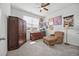 Cozy room featuring a ceiling fan, an armchair, desk, and a carpet at 1723 Perthshire Loop, Myrtle Beach, SC 29579