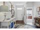 Welcoming foyer with hardwood floors, a rug, decor, and a front door at 1723 Perthshire Loop, Myrtle Beach, SC 29579