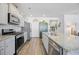 Modern kitchen with stainless steel appliances, granite countertops, and ample cabinet space at 1723 Perthshire Loop, Myrtle Beach, SC 29579