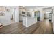 Kitchen with stainless steel appliances, granite countertops and island, seamlessly connected to living area at 1723 Perthshire Loop, Myrtle Beach, SC 29579