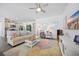 Comfortable living room featuring hardwood floors, modern furniture, and a ceiling fan at 1723 Perthshire Loop, Myrtle Beach, SC 29579