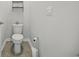 A clean toilet room with a standard toilet and minimalist design at 1723 Perthshire Loop, Myrtle Beach, SC 29579