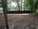 View of the backyard and fence in need of landscaping at 1903 Rose St., Conway, SC 29527