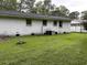 Large backyard features lush green grass, a well-maintained lawn, and a brick exterior home at 1903 Rose St., Conway, SC 29527