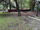 Secluded backyard features a hammock strung between mature trees, offering a peaceful retreat at 1903 Rose St., Conway, SC 29527