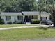 Charming single-story home featuring a brick facade, manicured lawn, and mature trees at 1903 Rose St., Conway, SC 29527