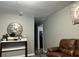 Hallway with light wood-look flooring, gray walls, and a view into other rooms at 1903 Rose St., Conway, SC 29527
