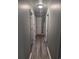 Hallway with light wood-look flooring and gray walls with white trim at 1903 Rose St., Conway, SC 29527