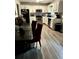 Bright kitchen showcases modern appliances, white cabinets, and wood-look flooring; perfect for cooking at 1903 Rose St., Conway, SC 29527