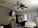 Main bedroom featuring a platform bed, whitewashed walls, an accent brick wall and natural light at 1903 Rose St., Conway, SC 29527
