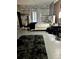 Spacious main bedroom featuring whitewashed walls, a platform bed and unique decorative accents at 1903 Rose St., Conway, SC 29527