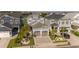 Beautiful community with multiple homes, green grass and palm trees around with a car parked in the driveway at 201 West Isle Of Palms Ave., Myrtle Beach, SC 29579