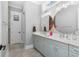 Modern bathroom with double sinks, marble countertops, and stylish fixtures, featuring a tiled floor at 201 West Isle Of Palms Ave., Myrtle Beach, SC 29579