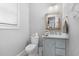 This half-bathroom offers a vanity with a marble countertop and a stylish, rustic mirror frame at 201 West Isle Of Palms Ave., Myrtle Beach, SC 29579