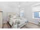 Bright bedroom with two windows, a ceiling fan and a floral comforter at 201 West Isle Of Palms Ave., Myrtle Beach, SC 29579
