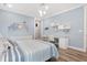 Bedroom showcases a modern design with a study area, stylish lighting, and minimalist decor at 201 West Isle Of Palms Ave., Myrtle Beach, SC 29579