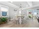 Well-lit dining area with large table and chairs, bright light and natural light with adjacent living room access at 201 West Isle Of Palms Ave., Myrtle Beach, SC 29579