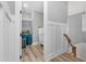 Hallway view featuring an open closet with ample storage and stairs with modern railing at 201 West Isle Of Palms Ave., Myrtle Beach, SC 29579