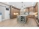 Spacious kitchen featuring a large center island, custom cabinetry, stone countertops and backsplash, and stainless appliances at 201 West Isle Of Palms Ave., Myrtle Beach, SC 29579