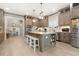 Bright kitchen with granite countertops, stainless appliances and a center island open to the dining and living spaces at 201 West Isle Of Palms Ave., Myrtle Beach, SC 29579