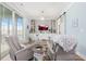 Living room showcasing two comfortable arm chairs, custom built ins, and natural light from the balcony at 201 West Isle Of Palms Ave., Myrtle Beach, SC 29579