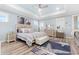 Bedroom features a serene color palette, tray ceiling, and a cozy seating area at 201 West Isle Of Palms Ave., Myrtle Beach, SC 29579