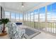 Beautiful sunroom with large windows offering exterior views, comfortable seating and ample space at 201 West Isle Of Palms Ave., Myrtle Beach, SC 29579