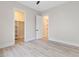 An airy bedroom features neutral walls, light vinyl floors, and a walk-in closet at 2205 Yellow Morel Way, Myrtle Beach, SC 29579