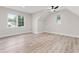 An attic bedroom features a ceiling fan, dormer window, and light vinyl floors at 2205 Yellow Morel Way, Myrtle Beach, SC 29579