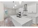 Bright kitchen with quartz countertops, stainless steel appliances, a modern faucet, and a sleek design at 2205 Yellow Morel Way, Myrtle Beach, SC 29579