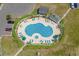 Aerial view of a sparkling community pool, lounge chairs and nearby parking at 222 Landing Rd. # 1811, North Myrtle Beach, SC 29582